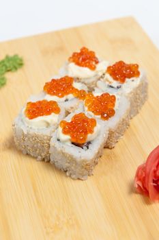 Sushi on wooden stand isolated on white background