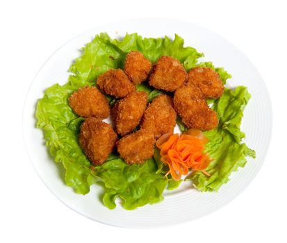 Battered fish on a plate isolated on white background