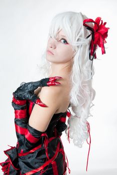 Girl in manga style suit on white
