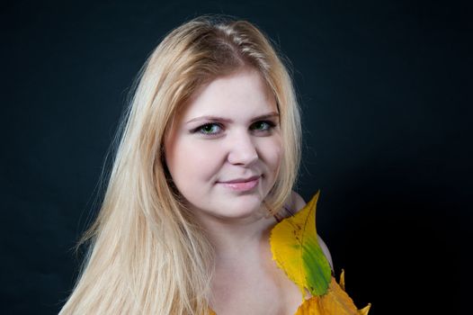 portrait blonde girl on black background