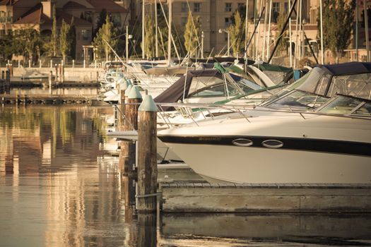 Boats and reflections of yachts in still water