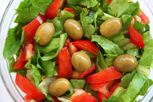 Healthy vegetarian Salad on the glass plate over white 