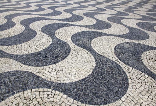Portugal. Lisbon. Typical portuguese cobblestone hand-made pavement 
