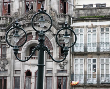 Portugal. Porto city. Ancient lantern opposite old house