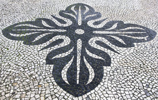 Portugal. Lisbon. Typical portuguese cobblestone hand-made pavement 
