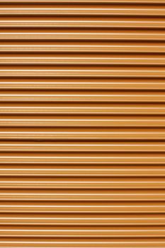 Orange corrugated tin sheet, perfect for designs or backgrounds