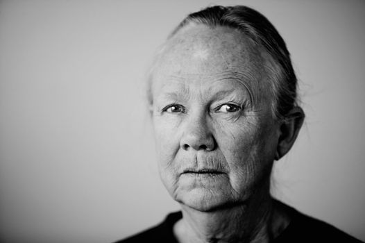 Portrait of a senior woman looking towards the camera.