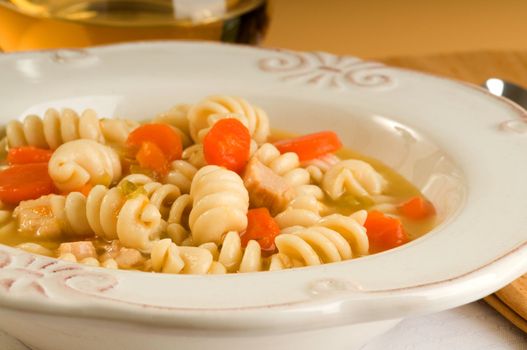 Bowl of hot homemade chicken noodle soup.