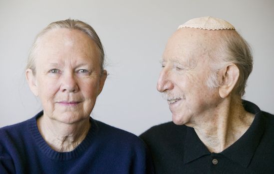 Close-up of eldery Jewish couple in studio.