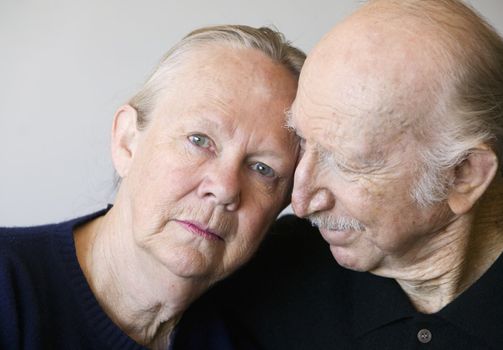 Close-up of senior couple focusing on worried woman