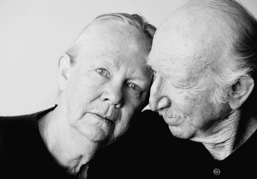 Close-up of senior couple focusing on worried woman