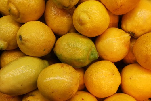 frame filling shot of lemons at a farmers market high detail, great for your designs