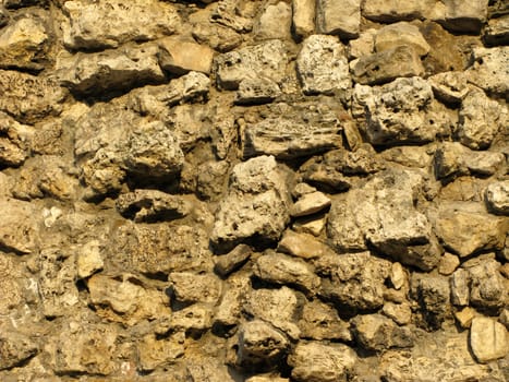 Fragment of limestone wall surface texture