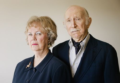 Portrait of Wealthy and Snooty Senior Citizens with Strong Woman and Cowering Man