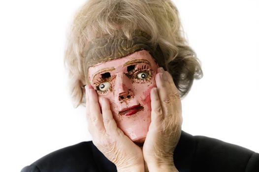 Close-up of a woman with a mask against a bright white background