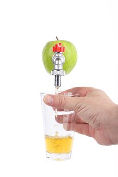 Green apple with faucet and apple juice streaming from it, concept of freshness and healthy diet