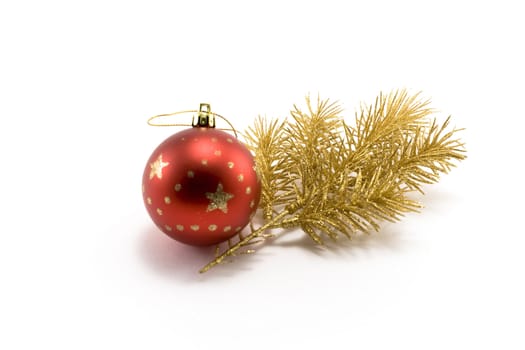 Red ball and gold(en) spruce isolated on white background