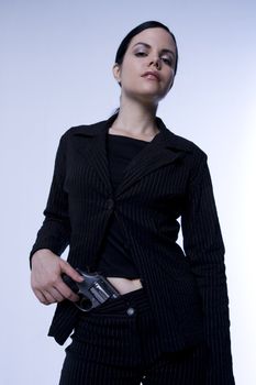 Beautiful woman with .357 Smith & Wesson revolver. Woman dressed in professional black suit, could be Secret Service or FBI/CIA.