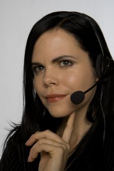 Woman with telephone headset. Can be used for customer support, call center, communication, business, etc.