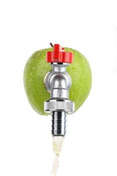 Green apple with faucet streaming apple juice isolated on white, high key lighting