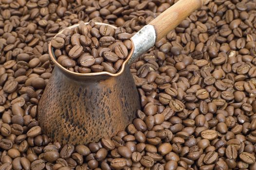 Turkish coffee pot and coffee beans.