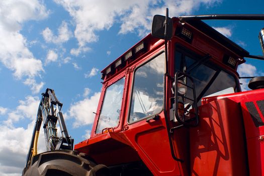 red tractor cabine on blue sky background