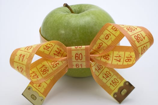 Green Apple with measuring tape.
