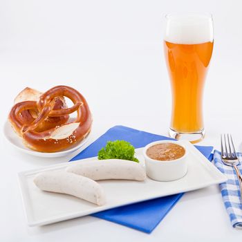 weisswurst white sausages and sweet mustard with pretzel  bavarian traditional food