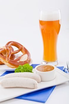 weisswurst white sausages and sweet mustard with pretzel  bavarian traditional food