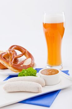weisswurst white sausages and sweet mustard with pretzel  bavarian traditional food