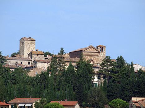 Small town in Tuscany amongst vineyards and an olive groves