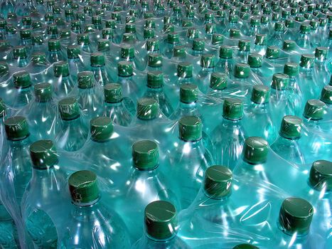 The packed bottles with mineral water ready to sale