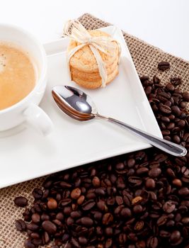 fresh aromatic coffee and cookies on wooden table 
