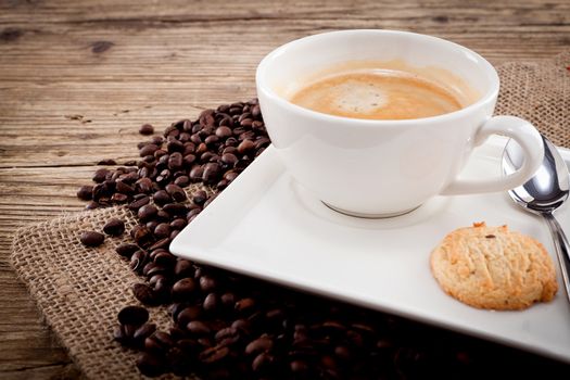 fresh aromatic coffee and cookies on wooden table 