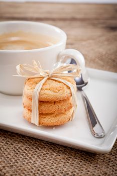 fresh aromatic coffee and cookies on wooden table 