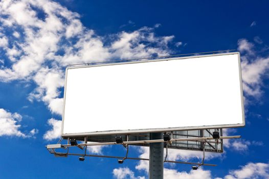 Empty billboard in front of beautiful cloudy sky