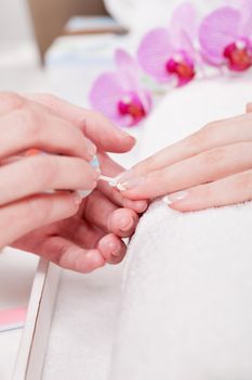 professional manicurist doing a manicure natural look 