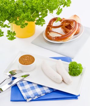 weisswurst white sausages and sweet mustard with pretzel  bavarian traditional food