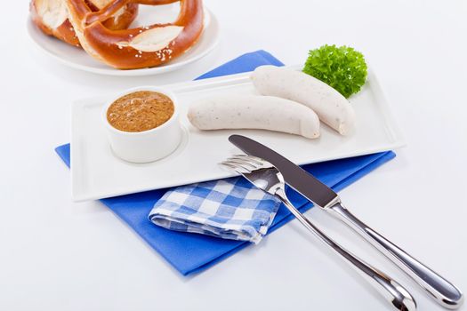 weisswurst white sausages and sweet mustard with pretzel  bavarian traditional food