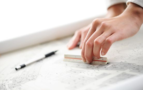 women hand on blueprint, shallow deep of field