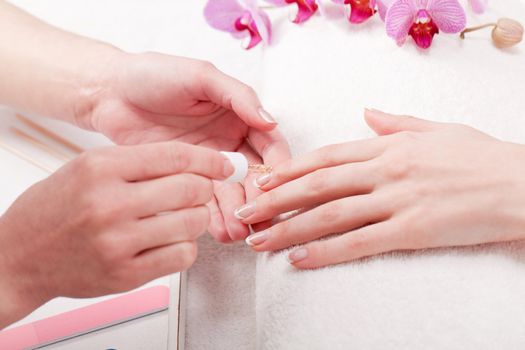 professional manicurist doing a manicure natural look 