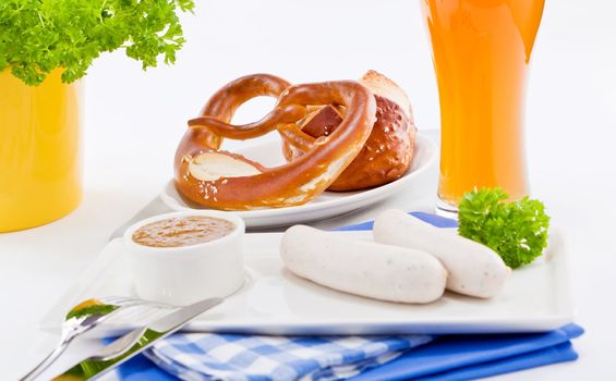 weisswurst white sausages and sweet mustard with pretzel  bavarian traditional food