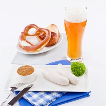 weisswurst white sausages and sweet mustard with pretzel  bavarian traditional food