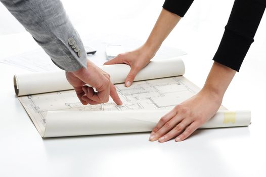 Architect�s hands pointing on the blueprint of new house project 