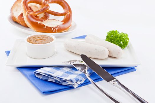 weisswurst white sausages and sweet mustard with pretzel  bavarian traditional food