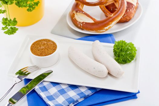 weisswurst white sausages and sweet mustard with pretzel  bavarian traditional food