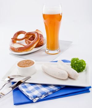 weisswurst white sausages and sweet mustard with pretzel  bavarian traditional food