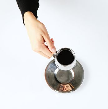 top view of a  woman hand's holding a cup of coffee