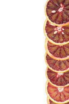 Slices of Perfect Ripe Blood Oranges as Frame closeup on white background