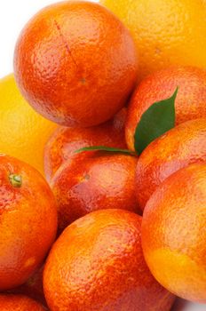 Perfect Fresh Blood Oranges with Green Leafs closeup on white background